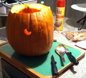 I drew a rough design of the minion on the pumpkin, and then started with fond a smaller knife to cut the eyeball.
